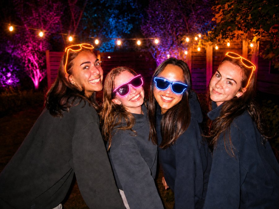 Customer wearing blue Sunglasses At Night glasses eating a s'more
